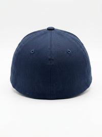 Navy blue fitted baseball cap (backside) on a white background